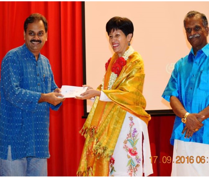 Receiving the second prize for national level poetry competition from Minsiter